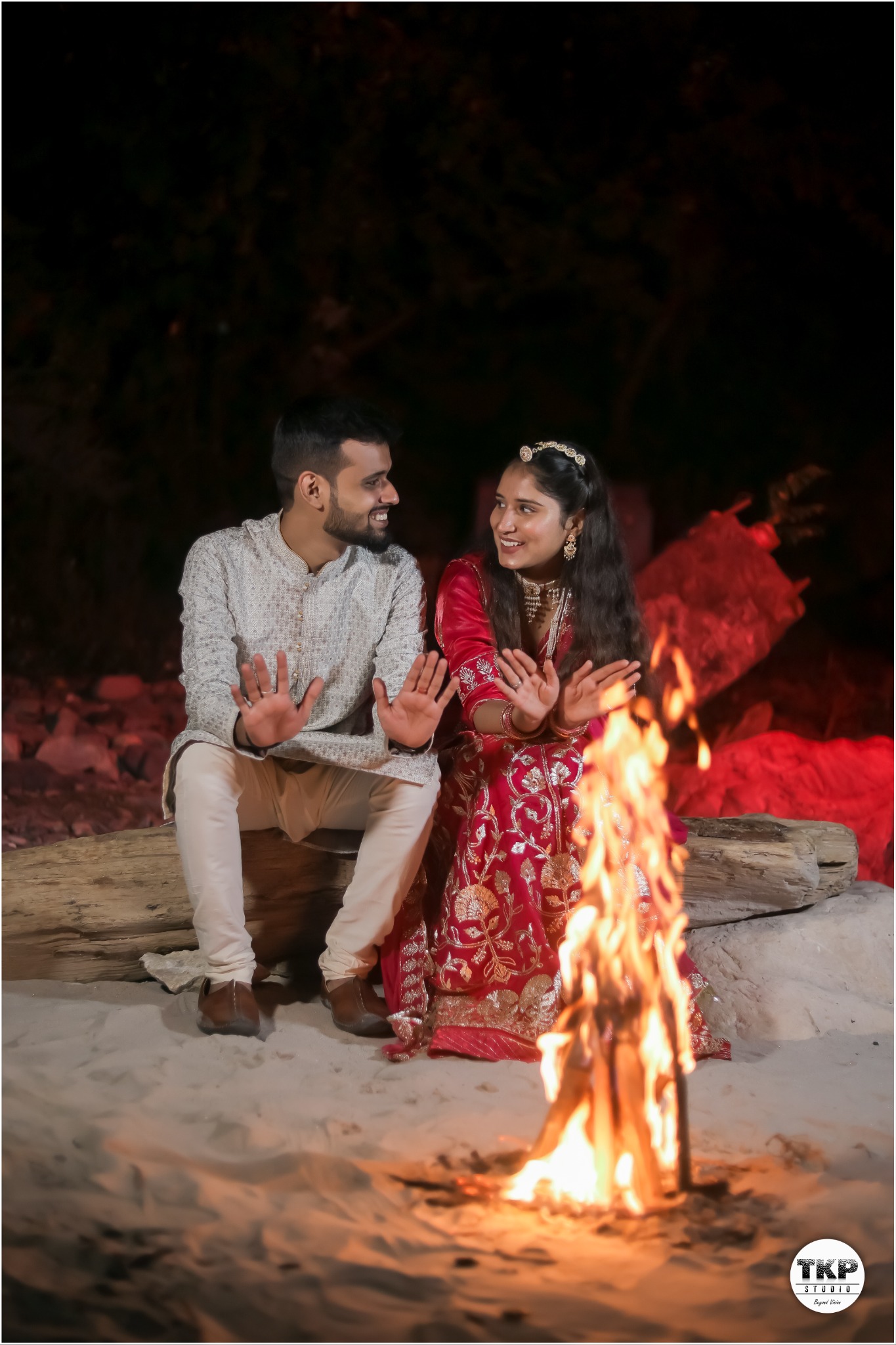 Couple sharing a bonfire moment