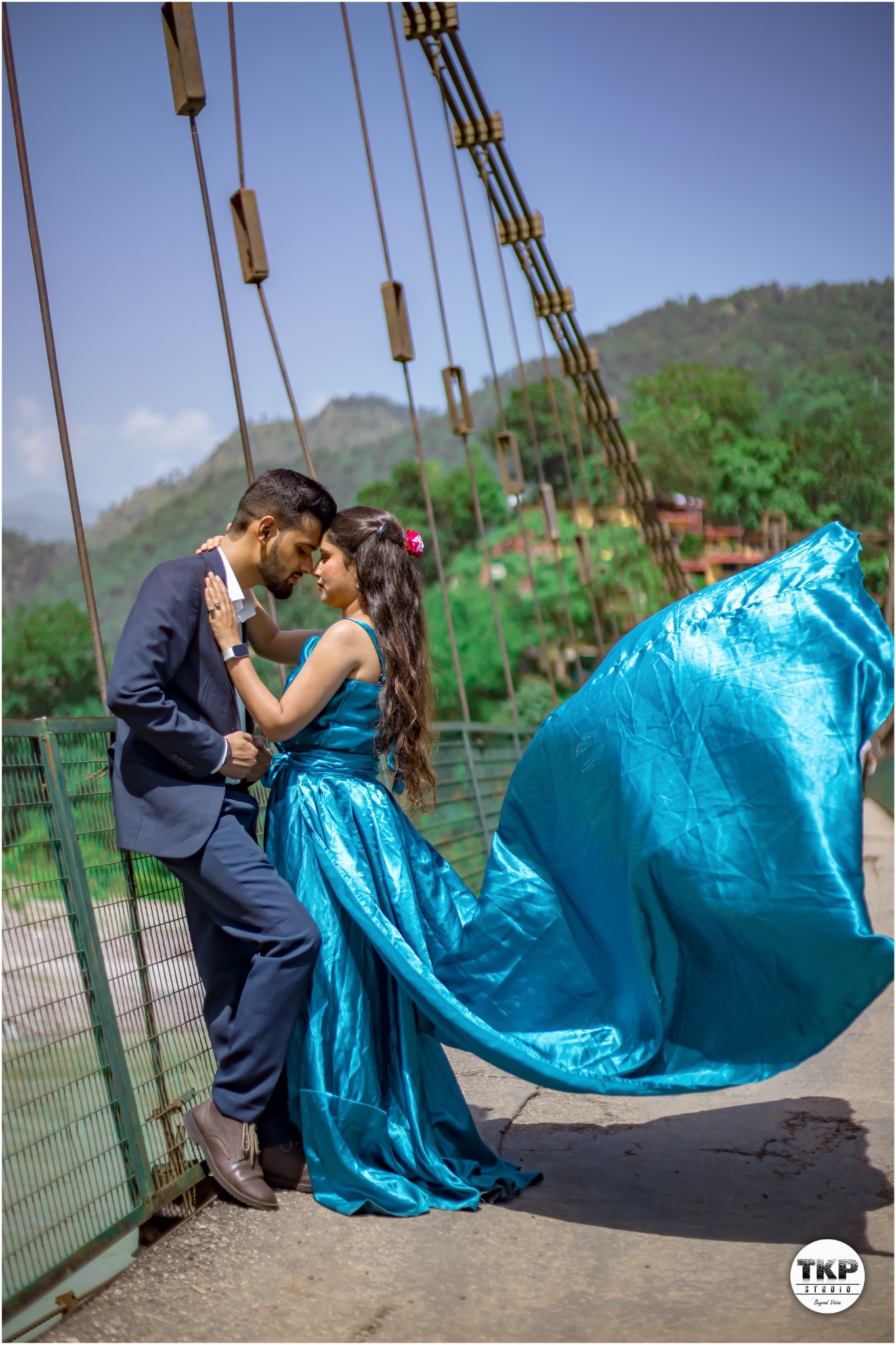 Dramatic teal dress pre-wedding portrait